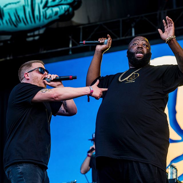 El-P and Killer Mike of Run the Jewels perform on main Grant Park stage during late evening set of day two of Lollapalooza on Friday Aug. 4, 2017 with El-P putting up the groups signature gun symbol. Photo courtesy of Scott Witt