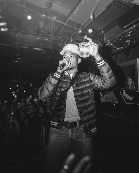 Chance the Rapper with drink in hand gives a toast to various people, including Lollapalooza and Studio Paris, right before he performs his Official Lollapalooza After Party at Studio Paris in Chicago on Saturday Aug. 5, 2017. Photo courtesy of Matt Marzhal